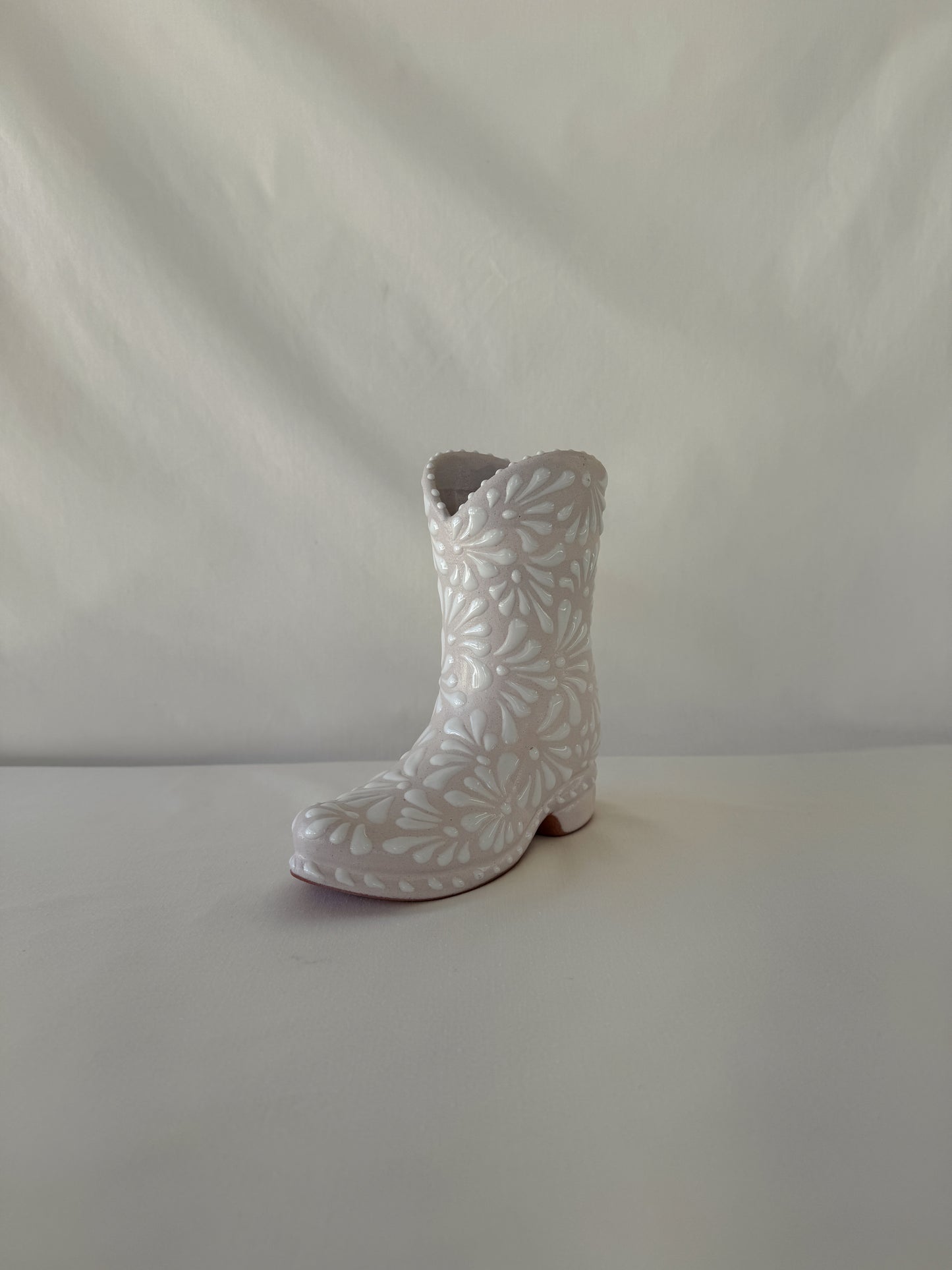 White Boot Vase Burst Design